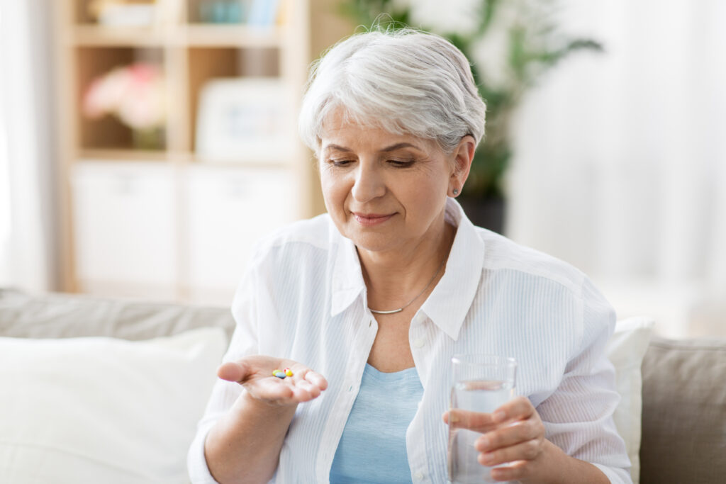 woman taking pills